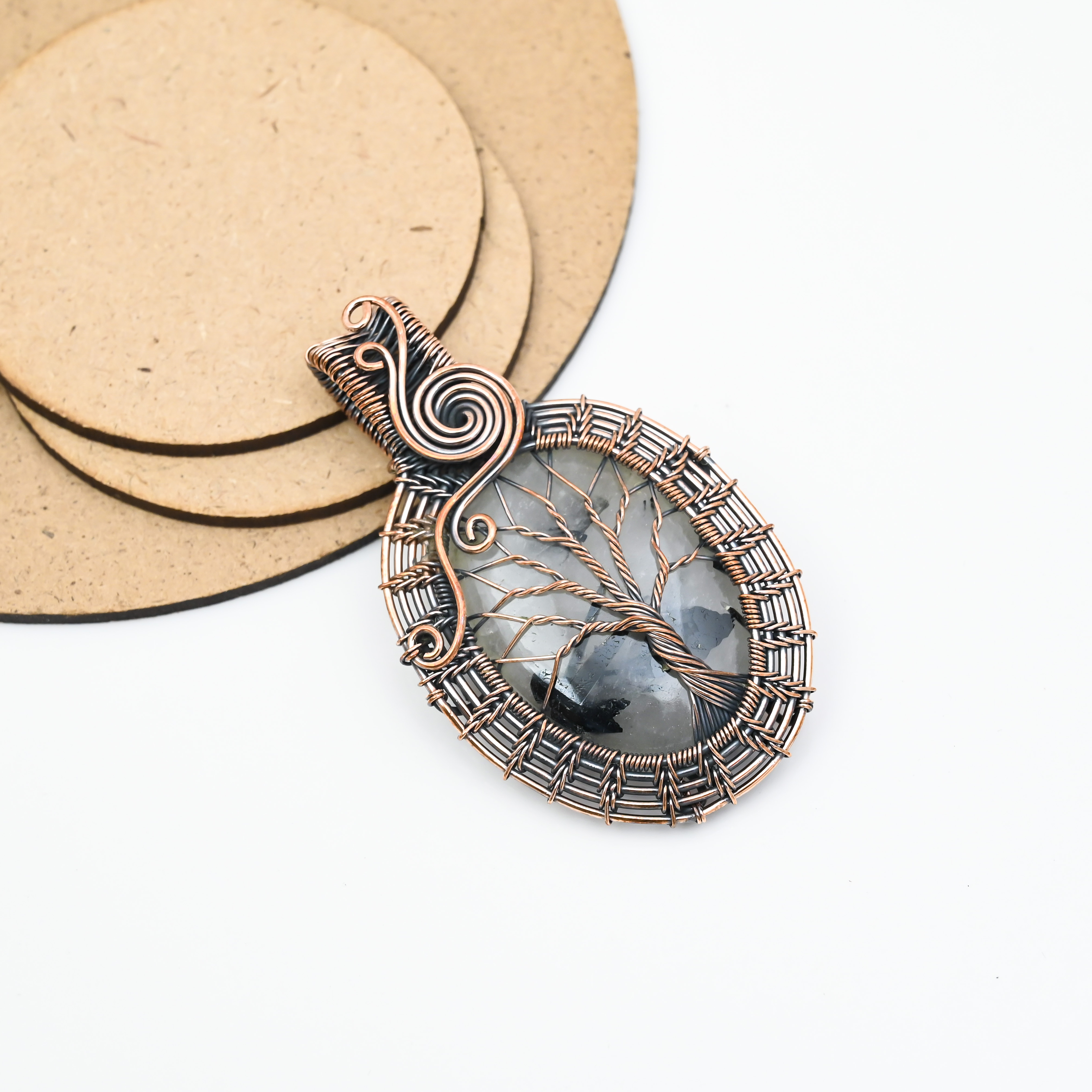 Handmade black rutilated quartz pendant wrapped in copper wire