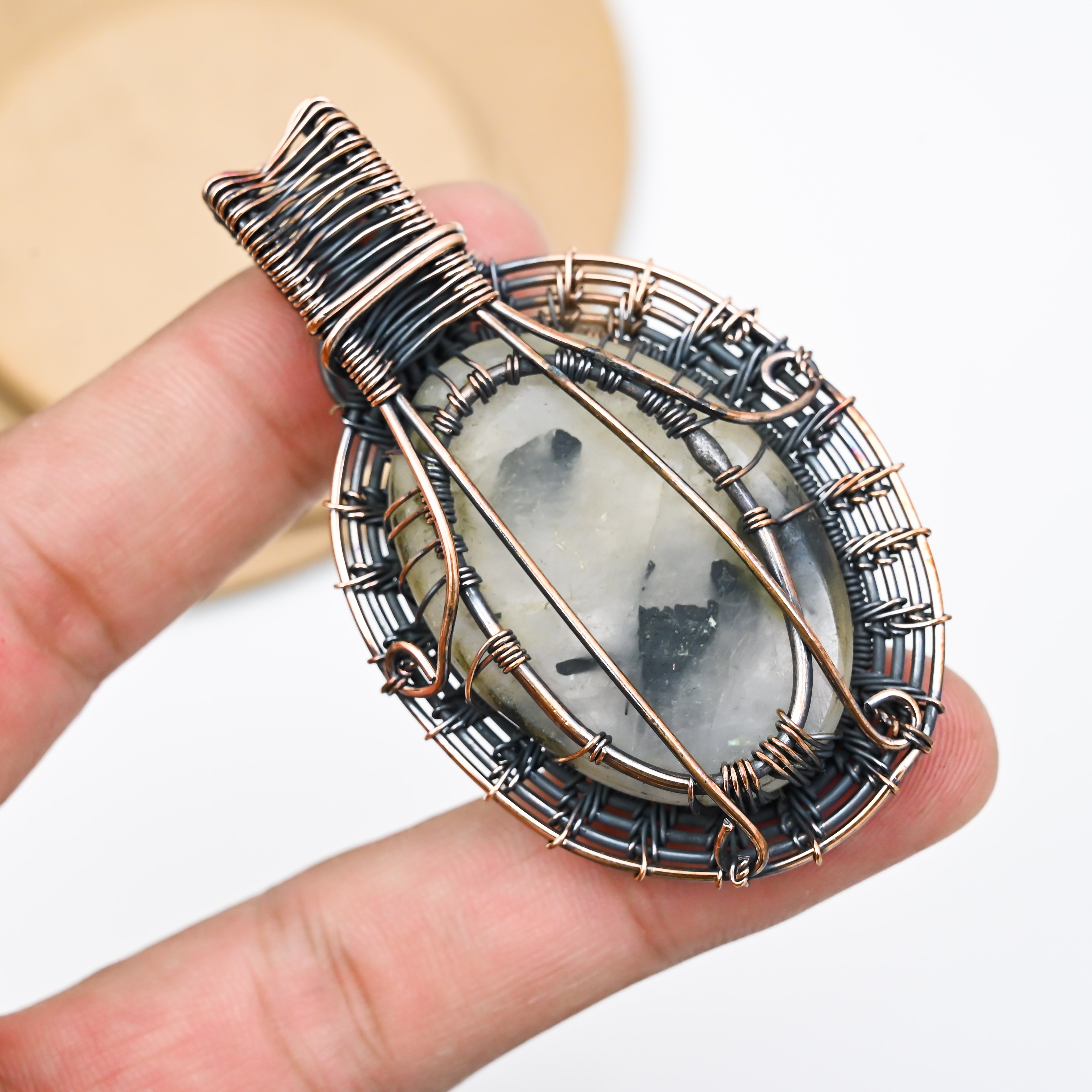 Handmade black rutilated quartz pendant wrapped in copper wire