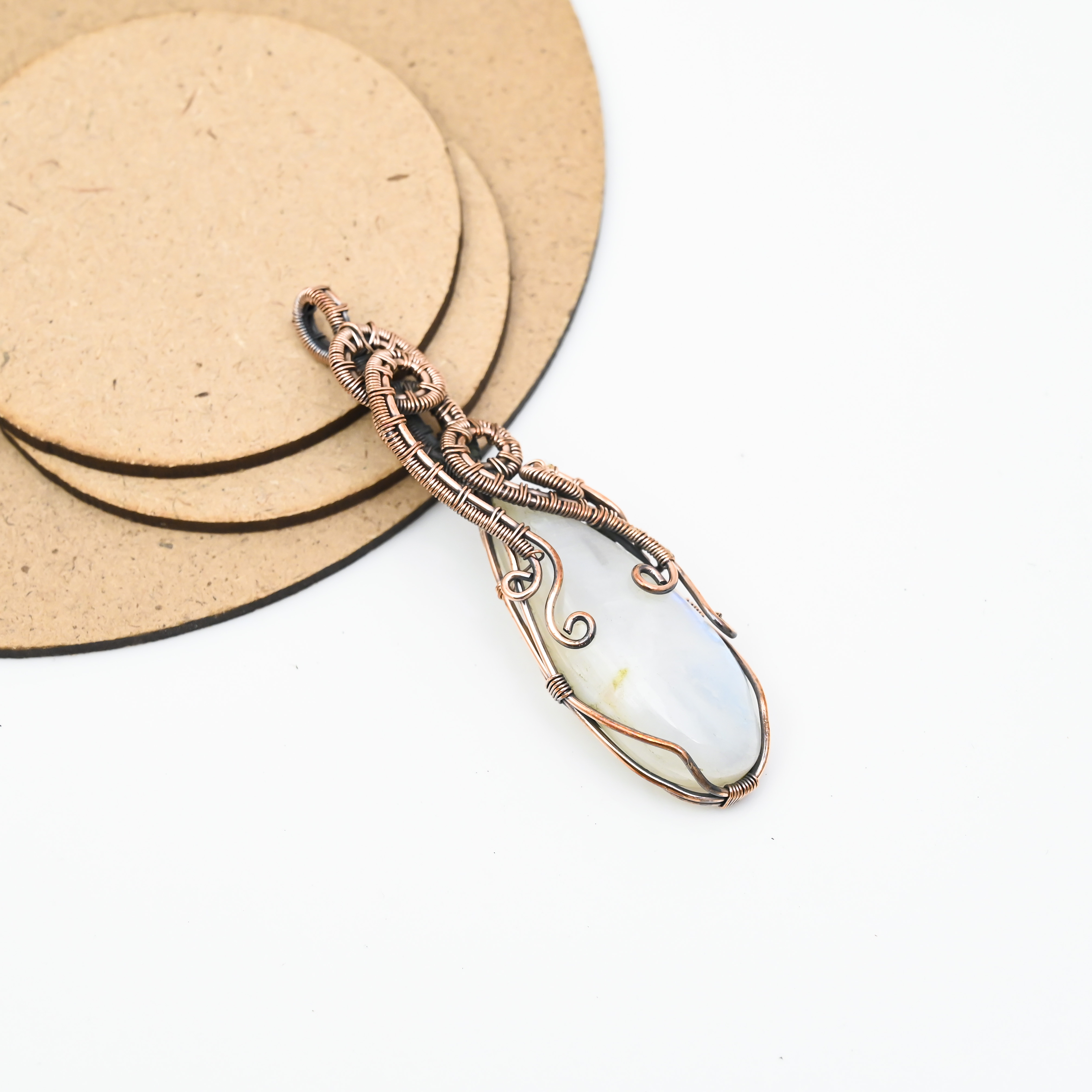 Handmade moonstone pendant wrapped in copper wire