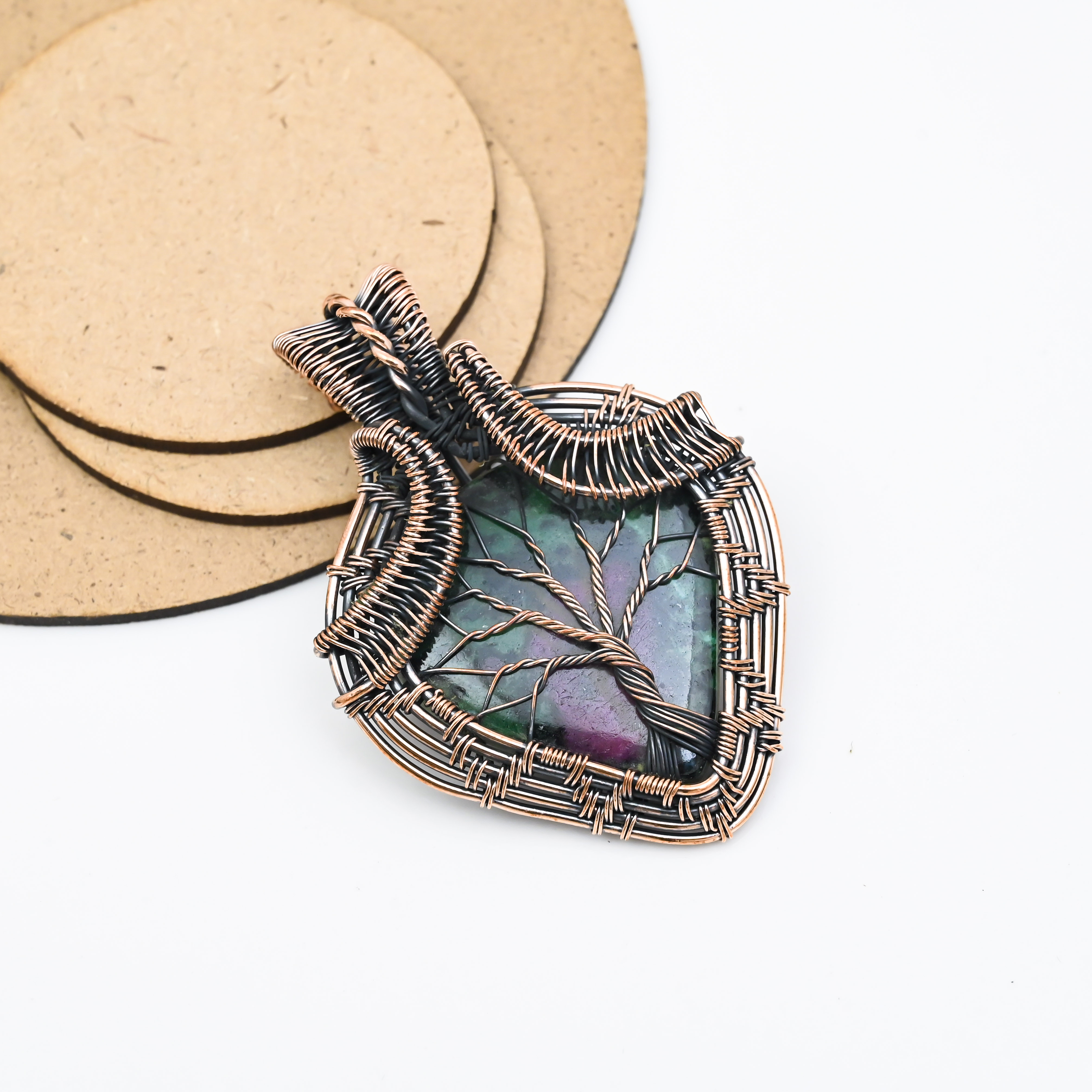 Handmade ruby zoisite pendant wrapped in copper wire