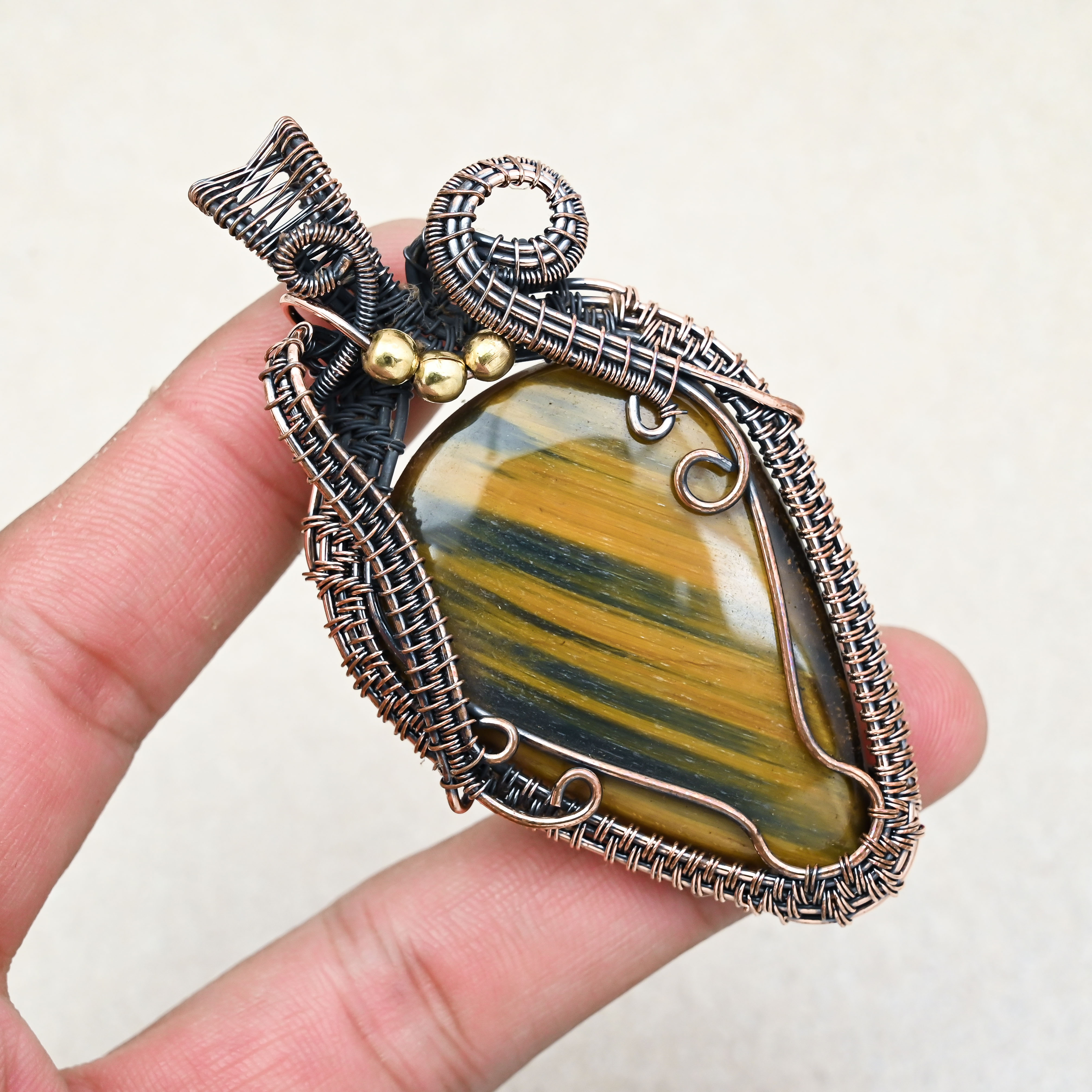 Tiger Eye healing gemstone pendant in copper wire