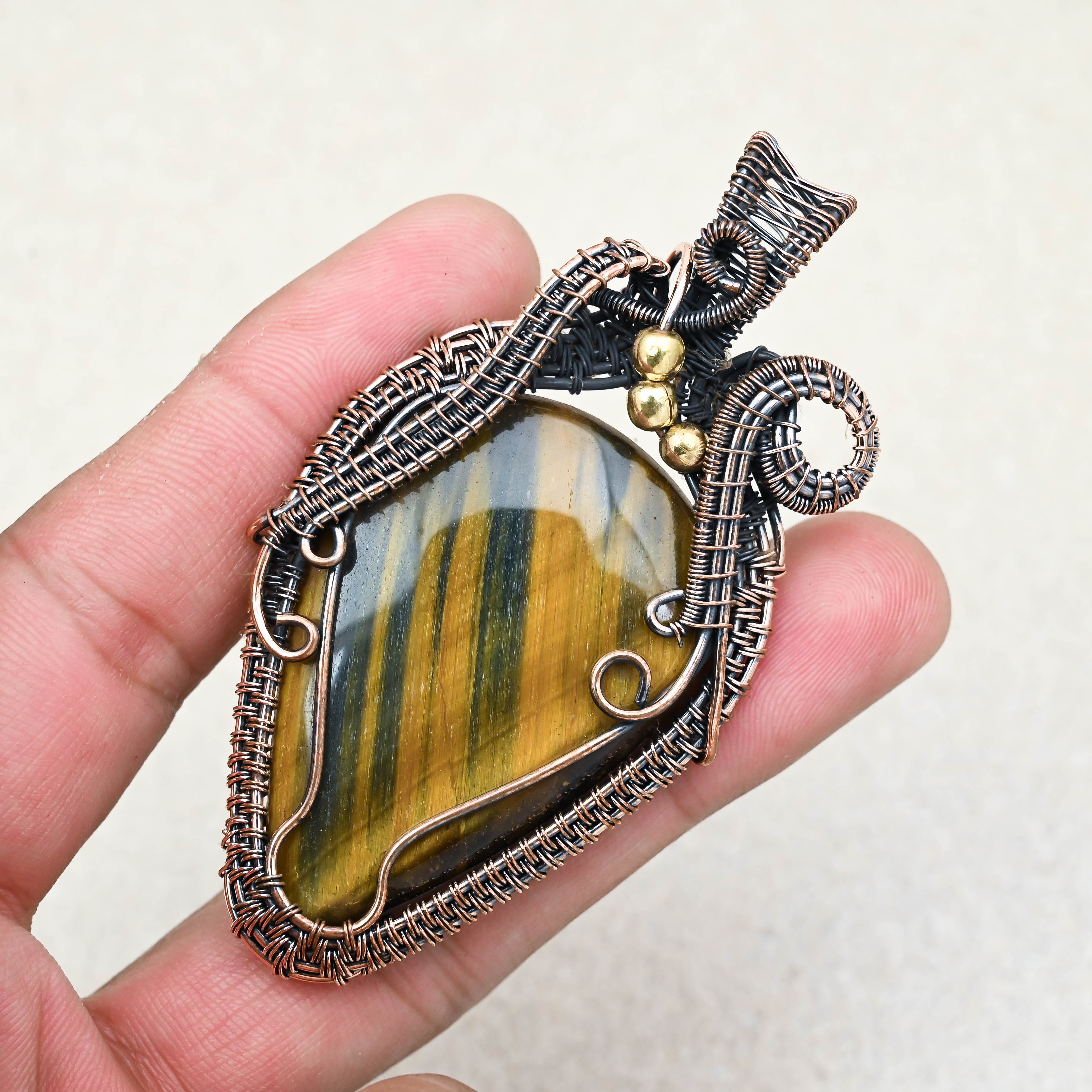 Tiger Eye healing gemstone pendant in copper wire